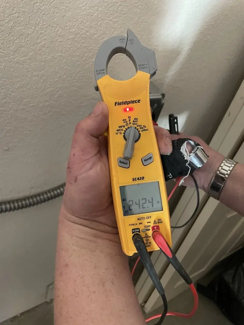 Voltage testing with clamp meter during Aluminum Wiring Replacement in South Houston